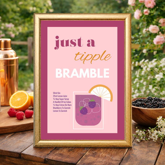 Framed bramble cocktail recipe wall art featuring a pink illustrated gin cocktail with blackberries and citrus, titled “Just a tipple Bramble,” styled outdoors with fresh fruit and greenery.