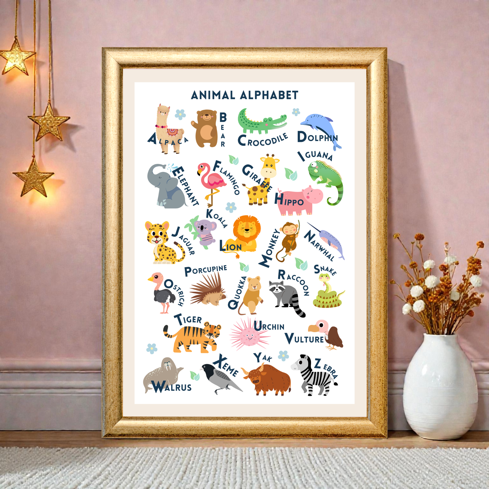 Framed animal alphabet poster on a wall with decorative elements.