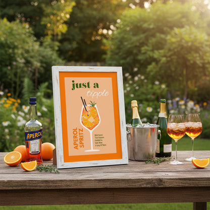 Framed print of an Aperol Spritz illustration with text on a pink background