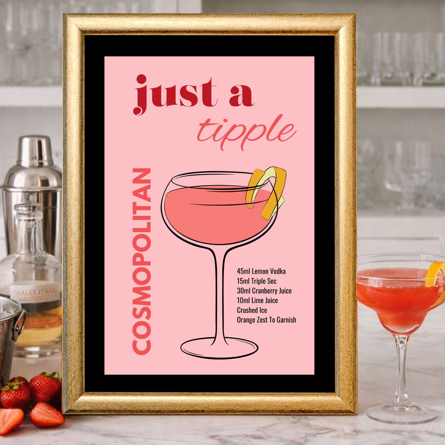 Framed cocktail recipe print with a Cosmopolitan drink illustration on a bar counter.