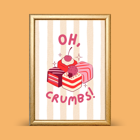 Cute cake illustration print with pink and red layered cake slices and the text “Oh, crumbs!” on a striped background, displayed in a gold frame on a warm neutral backdrop.