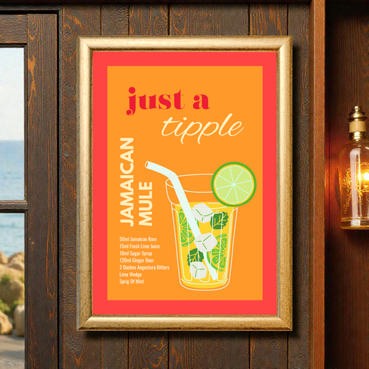 Framed Jamaican mule cocktail recipe print with orange and coral design, illustrated mule glass with lime and mint, displayed on a wooden wall with warm lighting in a bar-style setting.