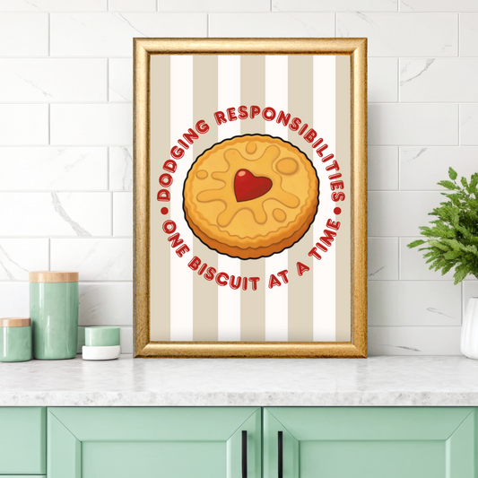 Biscuit quote wall art displayed in a kitchen, featuring a framed print with a heart jam biscuit and the phrase “Dodging responsibilities one biscuit at a time”