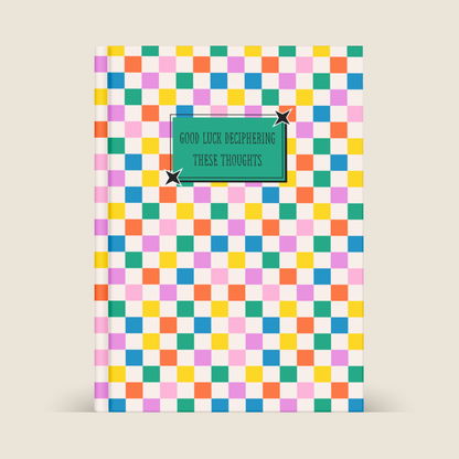 A5 softback notebook with colourful checkerboard cover and “Good Luck Deciphering These Thoughts” quote