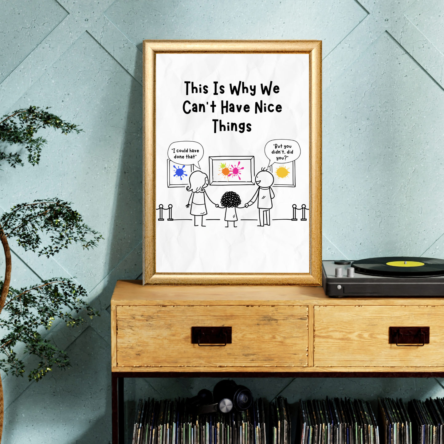 Funny art gallery illustration print displayed on a wooden cabinet in a living room, featuring the text “This Is Why We Can’t Have Nice Things”