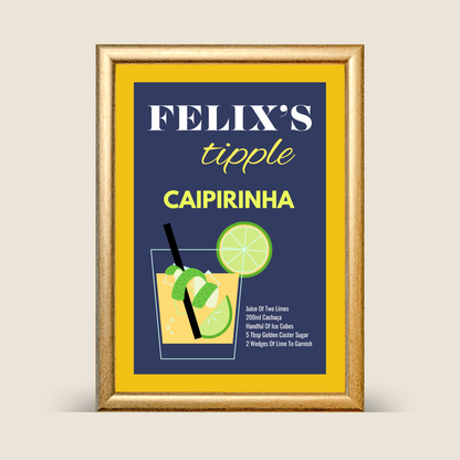 Framed personalised caipirinha cocktail recipe wall art featuring a navy background, yellow border, illustrated caipirinha glass with lime garnish, shown on a neutral background.