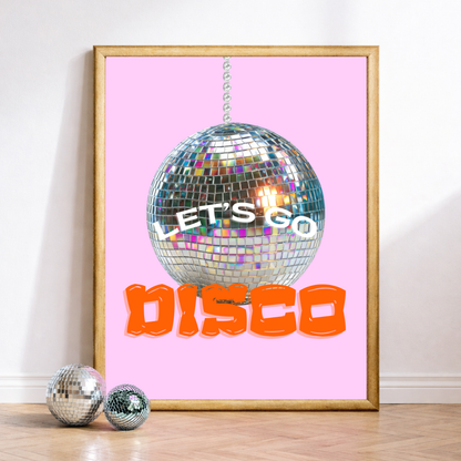 Framed poster with disco ball and 'Let's Go Disco' text on a pink background, with two smaller disco balls on the floor.