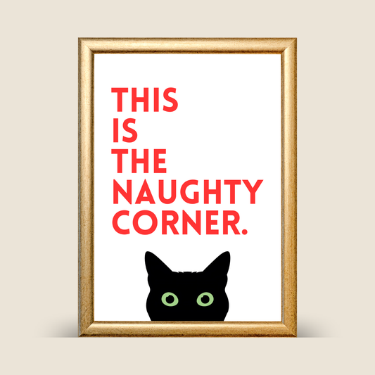 Minimalist cat quote print with red text reading “This is the naughty corner” above a black cat illustration, displayed in a gold frame on a neutral background.
