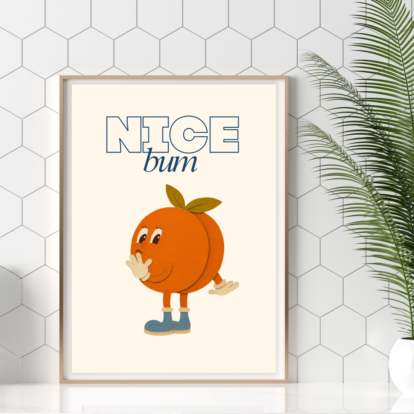 A retro cartoon peach character with little blue boots and a cheeky smile, with the words "Nice Bum" above in bold blue typography on a cream background. Print on a bathroom worktop.
