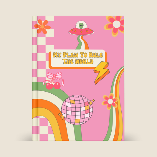 Pink hardcover journal with retro Y2K-inspired design featuring a UFO alien, disco ball, cherries, lightning bolt, rainbow and daisy illustrations. Title reads "My Plan To Rule The World" in yellow groovy font.