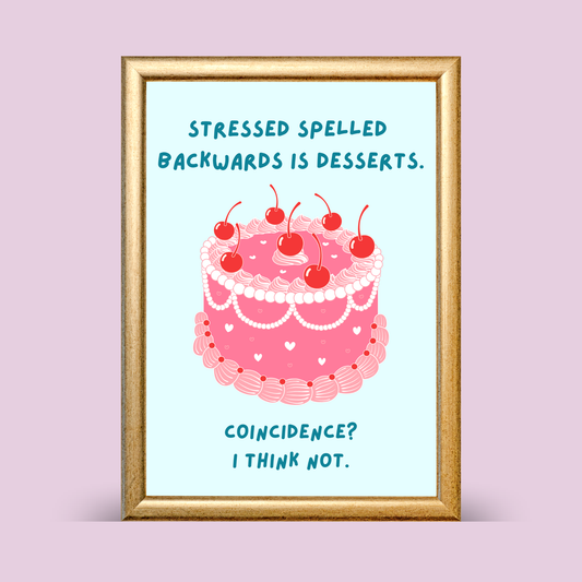 Framed print with a pink cake illustration and humorous text on a light purple background