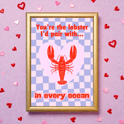 Framed “You’re the lobster I’d pair with… in every ocean” art print featuring a red lobster inside a heart on a pastel checkered background, styled with heart decorations.