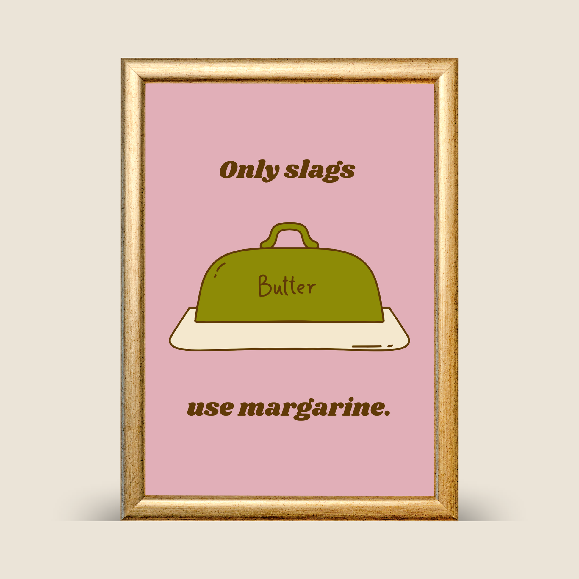 Framed poster with a green butter dish and text on a pink background