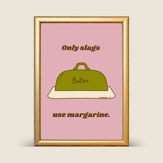 Framed poster with a green butter dish and text on a pink background